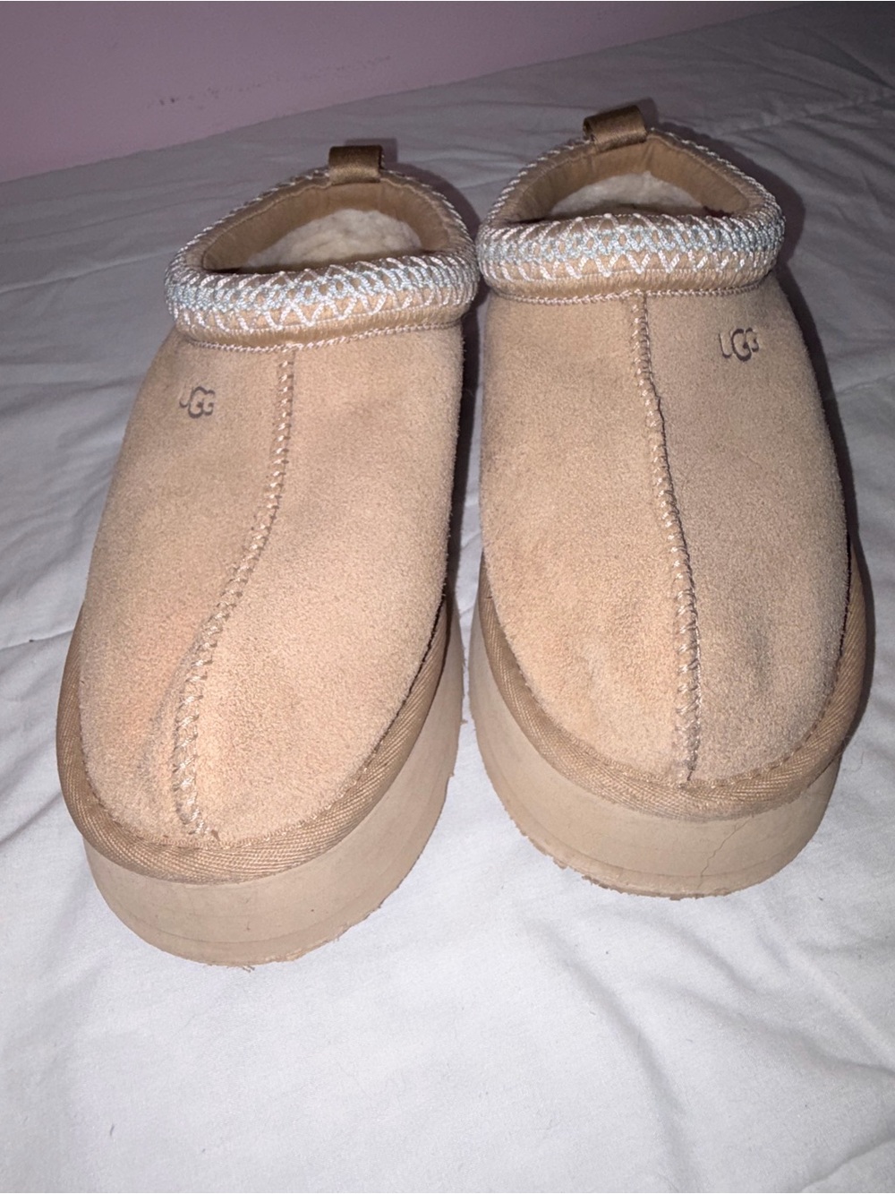UGG Tazz platform slippers in a neutral tan/sand suede color with cozy shearling